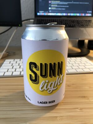 A can of beer showing the label of SUNN Light lager beer