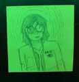 Twooney, a woman with light skin and medium colored hair at shoulder length, stands looking at the camera with an unsettled expression behind her large round glasses, the left side of which is shattered. She is wearing a lab coat. The drawing is pencil on a green neon sticky note.